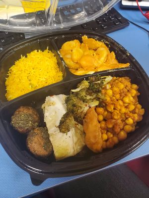 Features their vegan versions of their mac & cheese, chimichurri meatballs, cabbage wedge, lemon rice, channa masala, fish fillet, and broccoli. at Whole Foods Market in Detroit