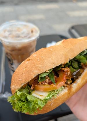 Vegan spicy tofu and vietnamese coffee with nut milk at Banh Mi Xanh in Ho Chi Minh City