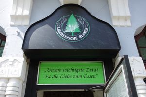Logo & motto ("Our most important ingredient is the love of food.") at Libanesische Blumen - Libanesische Küche & Grill in Saarbrucken