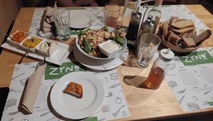 Caesar salad and three dips with bread at Zrno Bio Bistro in Zagreb