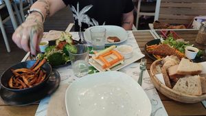 A basketull of homemade bread! The most amazing tofu on the planet with some of the best dipping sauces I ever tasted. at Zrno Bio Bistro in Zagreb