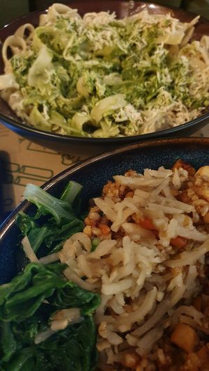 Pesto pasta & an amazing asian tofu dish. Excuse the terrible photo taken halfway through the meal! at Zrno Bio Bistro in Zagreb