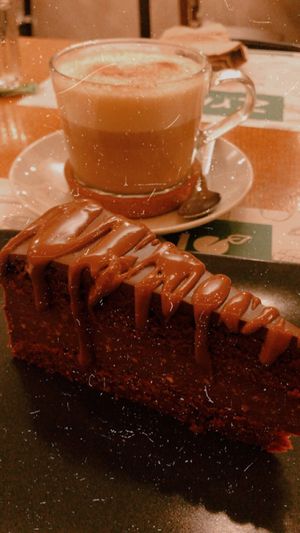 Chocolate cake and pumpkin spice latte  at Zrno Bio Bistro in Zagreb