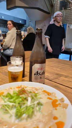 Nice big bottled beers and the waiter at Menya Shirakawa Bettei in Gifu