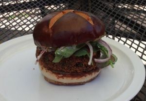 Buffalo Blue burger- sweet potato black bean burger with ranch and buffalo sauce, and veggies on a pretzel bun. So good! at Lulu's Local Eatery in St Louis