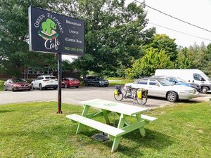 Plenty of outdoor seating on the patio and this picnic table (our tandem bicycle parked  in the lot) at Green Elephant Cafe in Kingston