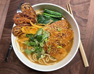 Noodles with soy sauce broth with vegetables and tempe. at Our Sunny Workshop in Kyoto