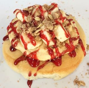 Peanut Butter Frosting, Sliced Bananas, Pie Crumble and Strawberry Jam at Cinnaholic - Union Station in Toronto