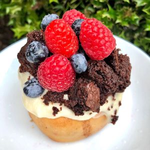 Vanilla Frosting, Raspberries, Blueberries, and Brownie Bites at Cinnaholic - Union Station in Toronto