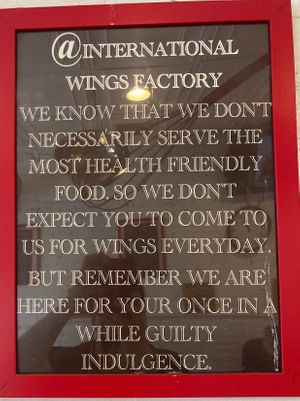 Sign in the store--this pretty much sums it up. at International Wings Factory in New York City