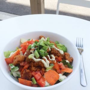 Buffalo Chick Salad with romaine, carrots, tomatoes, celery and vegan ranch dressing.  at Liberation Kitchen in Chicago