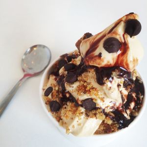 Vegan soft serve sundae with cookie crumbles, sprinkles, chocolate sauce. at Liberation Kitchen in Chicago