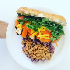 Bahn Mi with a side of purple rice + beans.  at Liberation Kitchen in Chicago
