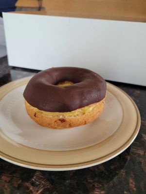 Lydia's Eclair: cake donut, chocolate glaze, homemade pastry cream sandwiched between at Liberation Kitchen in Chicago
