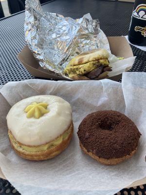 Cream filled donut, chocolate, and breakfast sandwich   at Liberation Kitchen in Chicago