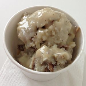 Mashed Potatoes & Gravy: Classic mashed potatoes with brown gravy and 
pepper. at Liberation Kitchen in Chicago