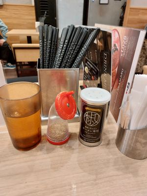 Extras on the table at Ippudo Ramen - Shijo Karasuma in Kyoto