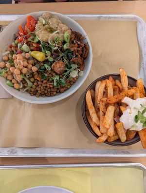 Earthly eats bowl and side of fries with vegan sauce at Kayma Algerian Eatery in San Francisco