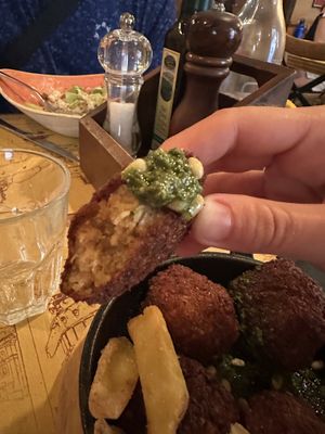 Chickpea balls w vegan pesto sauce sooo goodd  at Taverna 51 in Rome