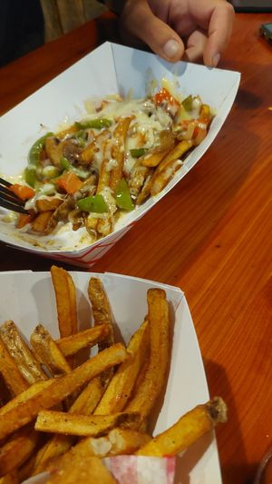 Fries with vegetables and cheese. at Oark General Store in Oark