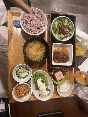 Manzoku Gozen Set with karaage, kurumabu with dark miso sauce, salad, kinpira gobou, tofu, potato salad, daikon and miso soup  at Komaki Shokudo in Tokyo