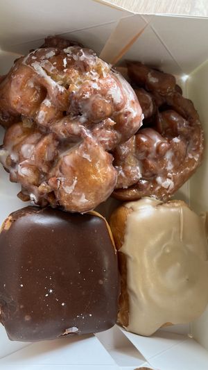 Apple Fritters, Maple Donut, Chocolate Donut  at Donut Land in Tualatin