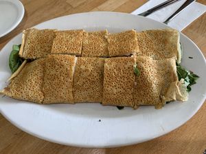 Bland, raw spinach stuffed crepe with unmelted cheese and tomato. Waited an hour. Big disappointment  at Crepes Bistro in Santa Clara