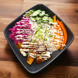 Tofu Bowl: Teriyaki Tofu, White Rice, Pickled Cabbage, Cucumbers, Carrots, Miso Dressing at Una Vaina Vegan in New York City