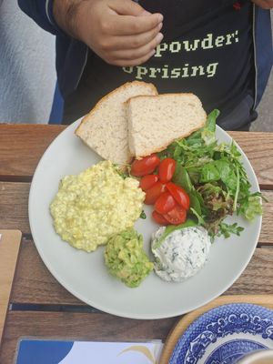 Breakfast plate with scrambled eggs at Piccola Cafe in Ljubljana