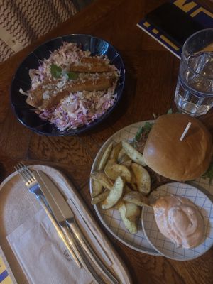 Crispy chicken salad with seitan and pulled beef burger  at Piccola Cafe in Ljubljana