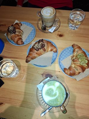 Pistachio croissant, chocolate croissant, matcha latte, cappuccino at Piccola Cafe in Ljubljana