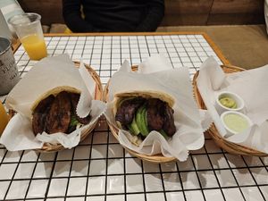 Vegan and vegetarian arepas with beans, avocado, tomato, fried plantains and cheese on the vegetarian arepa at Arepa Cafe in Lima