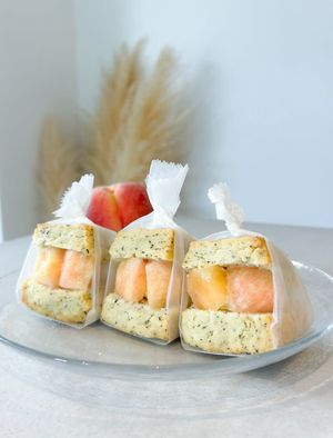 Juicy Japanese peach and lemon cream cheese, sandwiched in Earl Grey scones. One bite, and the fruity sweetness and tea aroma burst in your mouth! at iro scone in Yokohama