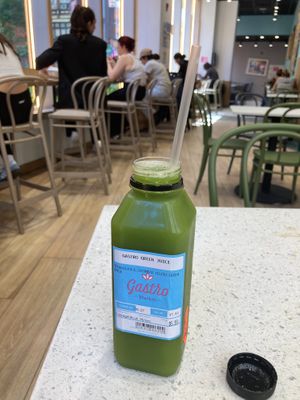 Healthy juice, tables to sit and eat at Gastro Market in New York City
