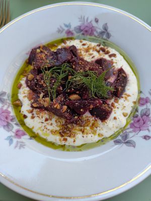 Roasted beetroot with "Labneh" and roasted almonds and dill infused oil. at Barbarella PLANT Bistro in Ljubljana