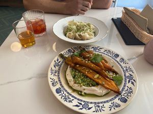 Filled ravioli and roasted carrots with cous cous   at Barbarella PLANT Bistro in Ljubljana