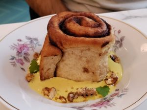 Cinnamon bun on creme. at Barbarella PLANT Bistro in Ljubljana