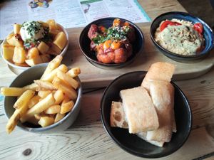Patatas bravas, bang bang cauliflower, hummus & chips. at Lounges - Santo Lounge in Southampton