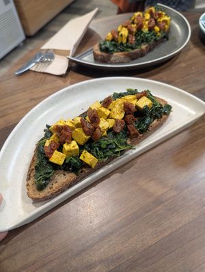 Raphie toast (tofu, spinach and cherry tomatoes) at Kaffeina in Valencia