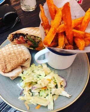Vegan roasted sweet potato burrito and sweet potato fries  at Lounges - Ludo Lounge in Bournemouth