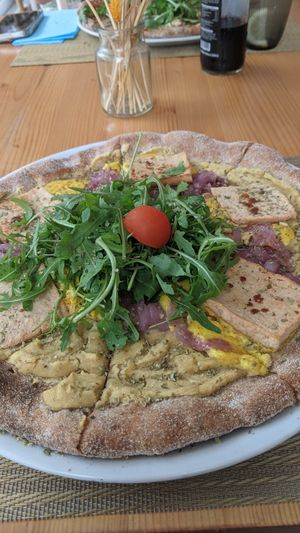 Pizza with tofu, caramelized onions, hummus and coconut cheese at Santé in Mallorca