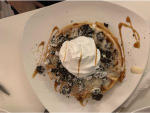 Waffle with vanilla pudding, oreos and cream at Creperie Lamara in Hannover