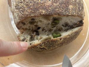 Inside the olive bread from Faria Bakery stand.   at Certified Farmers Market in Sacramento