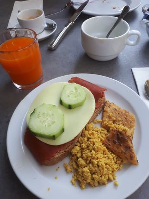 Bread with vegan cold cuts, scrambled tofu and farinata at Gabry in Riva Del Garda