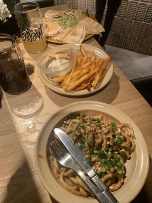 Split pea houmous, fries and peanut chilli noodles  at Brasserie Du Singe Savant in Lille
