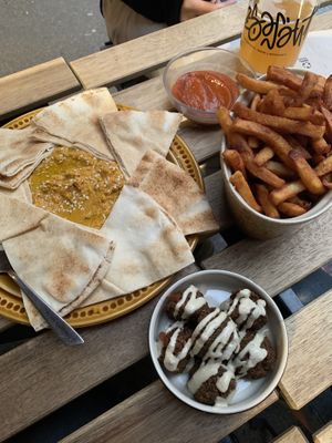 Baked carrot hummus, fries and homemade beer ketchup, and some falafels   at Brasserie Du Singe Savant in Lille