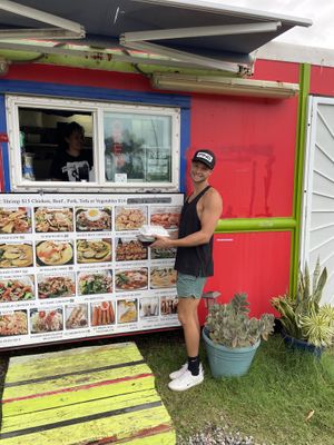 Menu pic with owner   at Thai Food Truck Express - Punalu'u in Hauula