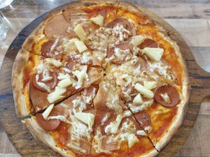 Americano (pepperoni, ham) w/ added pineapple $21.50: really good, thin base, could do with herbs, tasty home made chilli sauce at Pizzaminded in Pascoe Vale