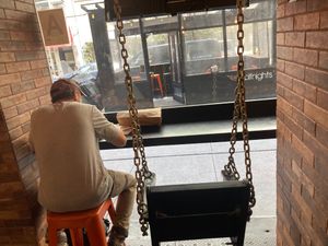 This is all the inside seating--just a stool and a swing. at Wolfnights in New York City