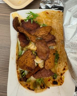 Himalayan wrap-Grilled Seitan & kohlrabi wrapped in ginger dough with spicy pickled pineapple, sumac onions, cilantro, toasted pumpkin seed, and vegan red chili aioli at Wolfnights in New York City